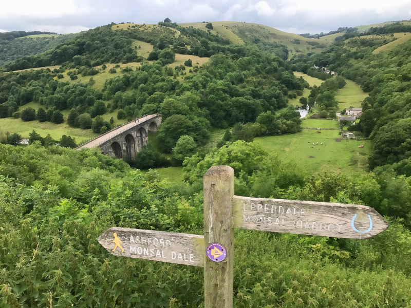 Signpost and Headstone viaduct at Monsal Dale