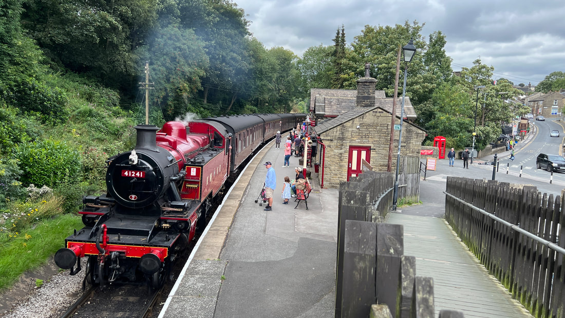 A steam train arriving at Haworth station on the Keighley Worth Valley Railway
