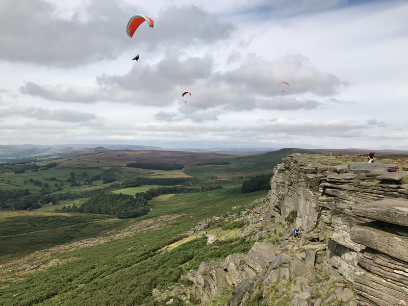 Paraglider over Stanage Edge in the Peak District